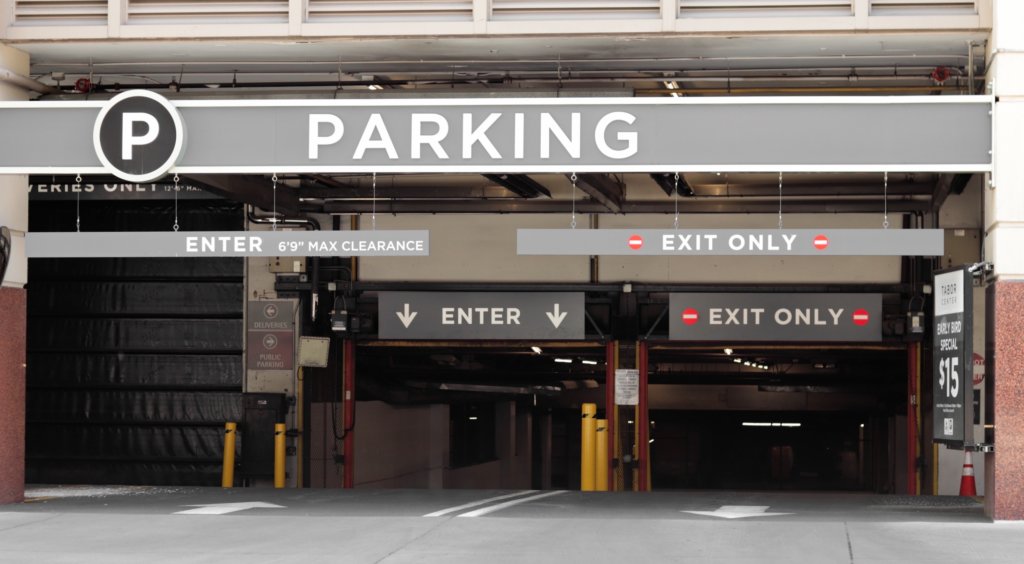 city building parking lot traffic downtown parking garage parking signage garage street photography t20 N08NWQ scaled
